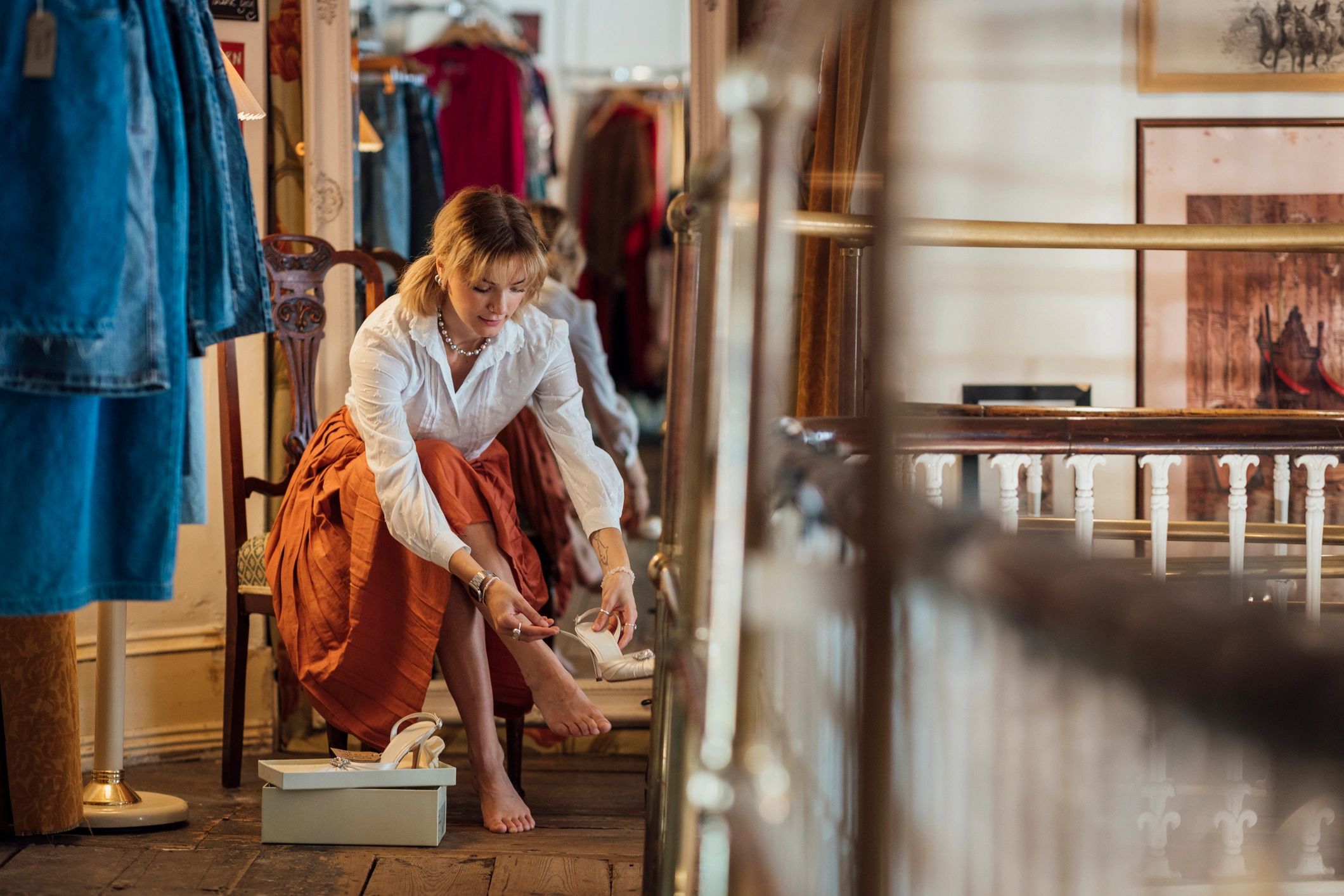 Woman trying on shoes in a fashion boutique